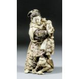 A Private Collection of Japanese Ivory and Boxwood Okimono and Netsuke A Japanese carved and stained