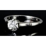 A silvery coloured metal mounted diamond solitaire ring, the brilliant cut stone of approximately .