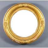 An early 19th Century gilt framed convex wall mirror, 21.5ins overall