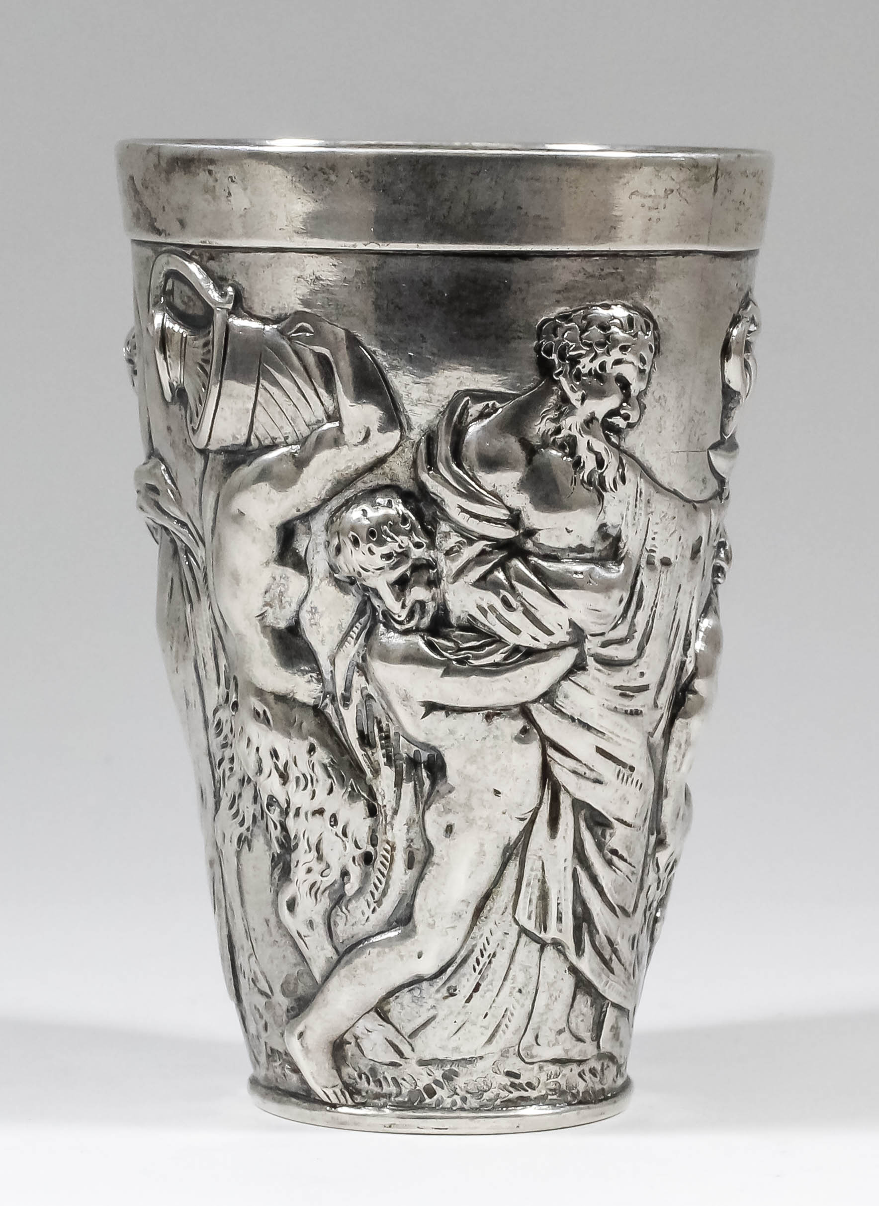 A late 19th/early 20th Century German silvery metal beaker by Th. Heiden, the tapered body cast in