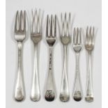 Eleven 18th Century silver three pronged table forks with moulded handles, possibly by Paul