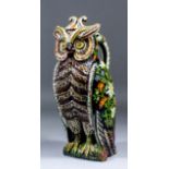 A late 19th Century Swiss (Thun) lead glazed owl jug and matched lid, decorated in coloured slip