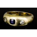 A modern 18ct gold sapphire and diamond set ring, the rectangular cut sapphire of approximately .