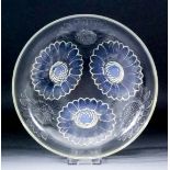 A Lalique pale blue opalescent and moulded glass shallow bowl, the exterior moulded in relief with