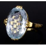 A modern 18ct gold mounted aquamarine ring, the oval cut stone of approximately 3ct (gross weight