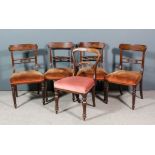 A set of four George III mahogany dining chairs, the rectangular crest rails with curved ends,