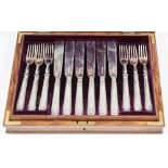 A set of twelve Edward VII silver fish knives and forks with plain silver blades and moulded and