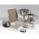An Elizabeth II silver baluster-shaped tankard with leaf capped double C-scroll handle, on moulded