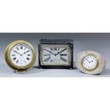 A small brass cased miniature bulkhead clock, the 2.375ins diameter white enamel dial with Roman