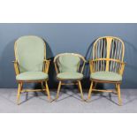 A pair of modern Ercol beechwood stick back armchairs with two tiered backs, solid splats, wood