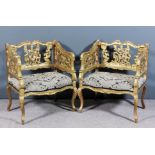 A pair of 19th Century French gilt square back bedroom armchairs, the shaped and moulded scroll