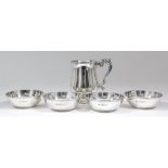 A George VI plain silver baluster-shaped tankard of 18th Century design, with moulded rim and