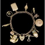 A modern 9ct gold curb link bracelet with heart pattern padlock, 190mm overall, hung with twelve