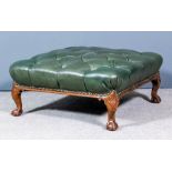 A 1920s walnut square stool, the top upholstered in green leather and deep buttoned on cabriole legs