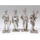 Four Elizabeth II cast silver models of soldiers in uniform (various regiments), 4ins and 4.25ins