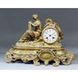 A late 19th Century French gilt metal cased mantel clock, the 3.25ins diameter white enamel dial