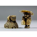 A Japanese carved ivory netsuke of Shoki and a demon, the demon seated on a large overturned