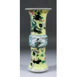 A Chinese porcelain gu vase enamelled in colours in the "Famille Verte" manner, with two four clawed