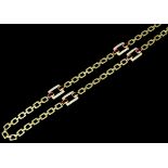 A modern 18ct gold ruby and diamond set necklace, the heavy oblong chain links interspersed by