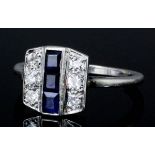 An Art Deco platinum mounted sapphire and diamond ring, the face channel set with three baguette cut