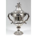 A Victorian silver two-handled regimental cup and cover, the whole embossed with leaf scroll and