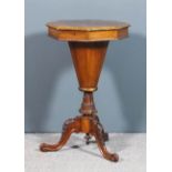 A Victorian walnut octagonal work table with matched quarter veneered top, the edge inlaid with