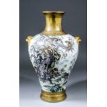 A Chinese porcelain baluster-shaped vase with gilt moulded mask and ring handles, the body finely