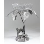 A late Victorian plated centrepiece modelled as two greyhounds standing on a rocky base beneath a
