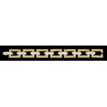 A modern French 18ct yellow and white gold diamond set bracelet,the seven rectangular rope pattern