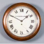 A walnut cased dial wall clock, the 10ins diameter painted metal dial with Roman numerals, to the