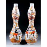 Two Japanese porcelain "Imari" double gourd-shaped vases enamelled in colours with warriors in a