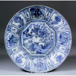 A Chinese blue and white "Kraak" porcelain charger painted with a bird perched on a rock, with