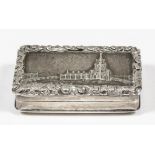 A George IV silver "Castle Top" vinaigrette, the lid decorated with a church within leaf and