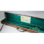 A late 19th/early 20th Century leather and canvas shotgun motor case bearing the trade label 'Army &