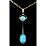 A modern gold coloured metal mounted opal set pendant, the oval cabochon cut opal of approximately