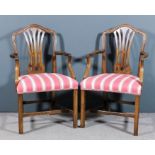 A pair of mahogany armchairs of "Hepplewhite" design, with moulded backs and fretted vase pattern