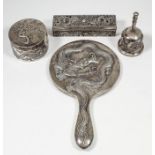 A Chinese silvery metal backed circular hand mirror embossed with a dragon, 11.5ins (9.2cm) overall,