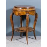 A 19th Century lady's walnut circular dressing table inlaid with boxwood leaf and scroll centre