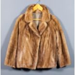 A lady's blonde mink jacket, lined, size 10-12, 26ins long