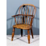 A 19th Century child's ash and elm seated stick back Windsor armchair with two tier back and