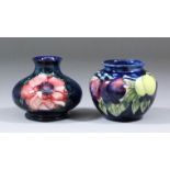 A Moorcroft miniature pottery vase, tube-lined and decorated in colours with "Anemone" design, 3.