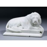 A late 19th Century French carved white marble figure of a seated lion, on rectangular plinth,