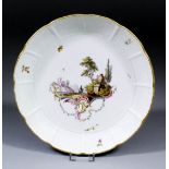 An 18th Century Ludwigsburg porcelain plate, the centre enamelled in colours with an imaginary