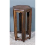 A Chinese Jichimu (chicken feather) wood hexagonal occasional table with flush panel to top, on