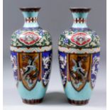 A pair of Chinese cloisonné enamel baluster-shaped vases decorated with mythical creatures in lappet