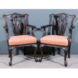 A pair of mahogany armchairs of "Chippendale" design, the backs with shaped crest rails with