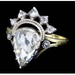 A late Victorian gold and silvery coloured diamond set ring, the pear cut diamond of approximately