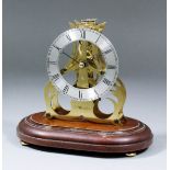 A 20th Century brass framed miniature Skeleton clock with 3.5ins diameter silvered chapter ring with