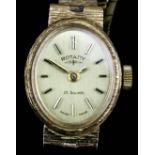A lady's 9ct gold Rotary wristwatch, the oval gilt face with baton numerals in rectangular pattern