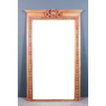 A Continental red painted and gilt framed rectangular overmantel mirror with moulded cornice, the